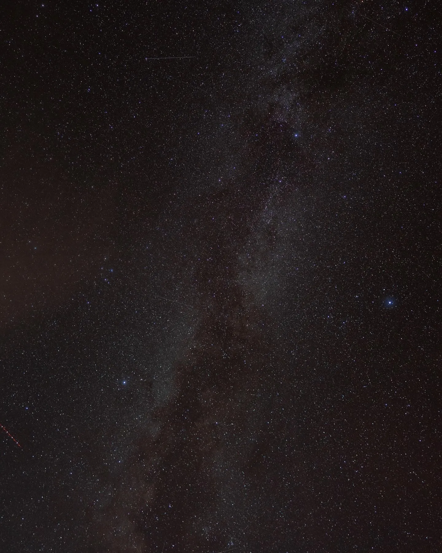 The Milky Way arcing across a dense starfield over the dark sky at Arches